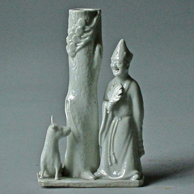 A statue of a person and a dog.