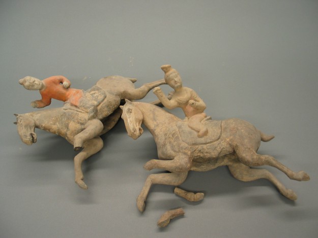 A group of figurines that are on the ground.
