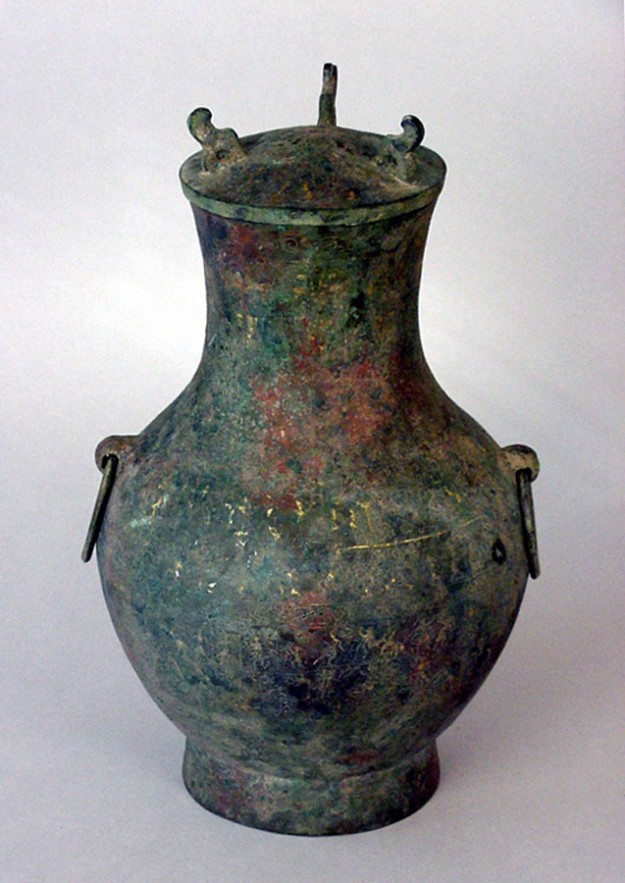 A large vase with two handles and a lid.