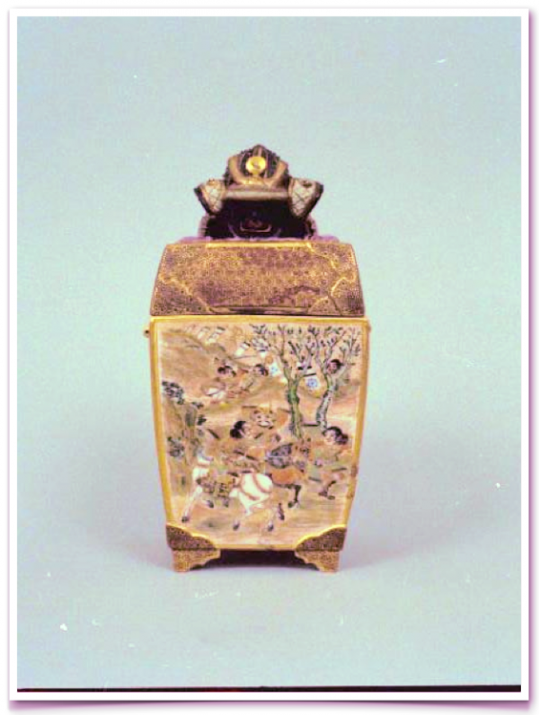A square shaped vase with a lid on top of it.