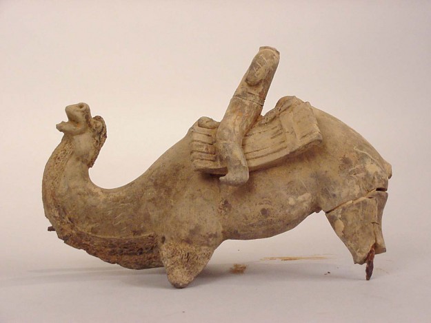 A sculpture of an elephant with its trunk raised.