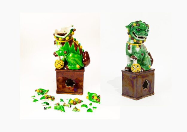 Two ceramic statues, one broken, one intact.